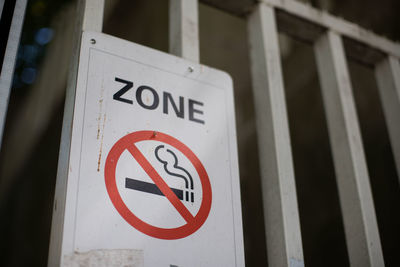 Close-up of no smoking zone sign