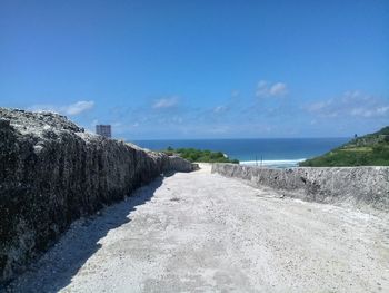 Scenic view of sea against blue sky