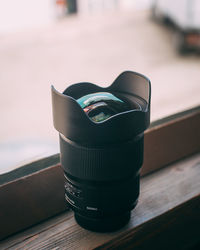 Close-up of camera on table