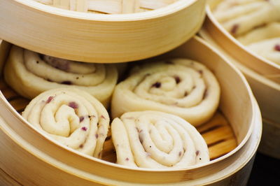 High angle view of chinese bread in bamboo steamer