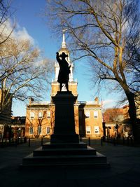 Low angle view of statue against sky