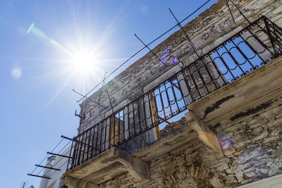 Low angle view of building against sky on sunny day