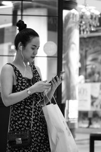 Young woman using mobile phone