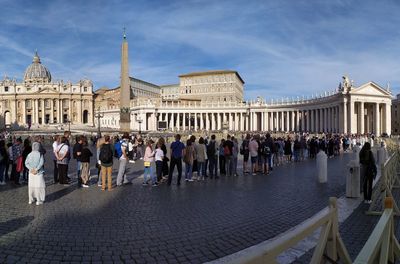 Group of people in front of historical building