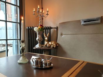 Electric lamp on table at home