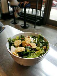 High angle view of salad in bowl on table