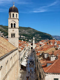 High angle view of buildings in town against sky