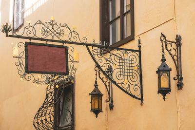 Low angle view of street light mounted on wall