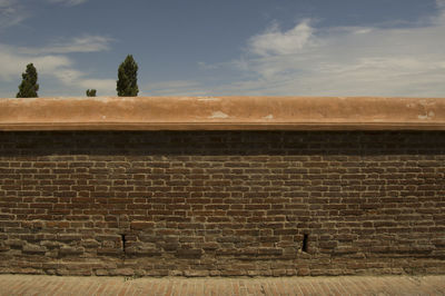 Low angle view of wall against sky