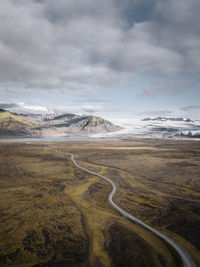 Scenic view of landscape against sky during winter