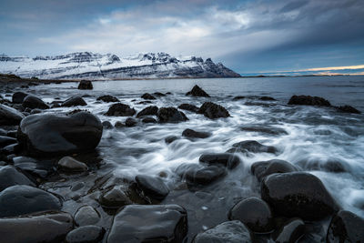 Scenic view of sea against sky during winter