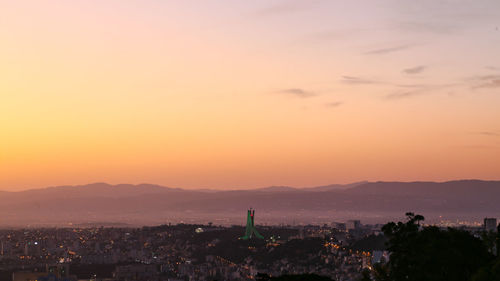 High angle view of buildings against sky during sunset