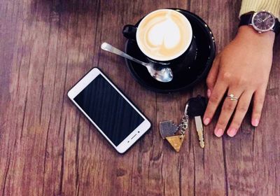 High angle view of coffee cup on table