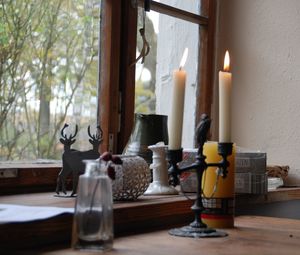 Tea light candles on table at home