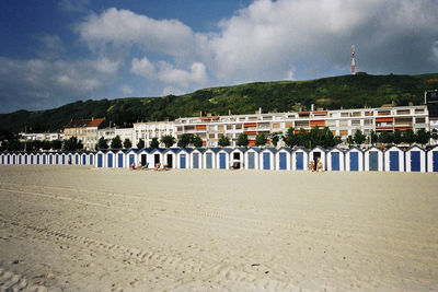 Scenic view of beach by sea against sky