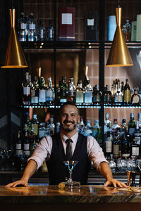 Portrait of smiling young man in restaurant