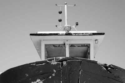 Low angle view of trawler against clear sky