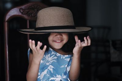 Portrait of smiling girl wearing hat