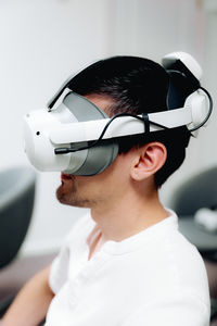 Side view of man wearing hat