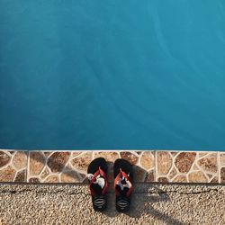 High angle view of people standing by swimming pool