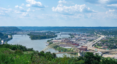 High angle view of bridge over river in city against sky