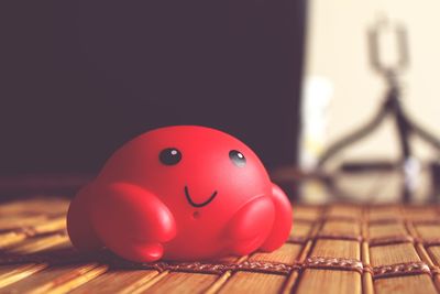 Close-up of red toy on table