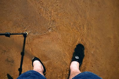 Low section of person standing on ground