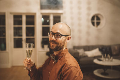 Portrait of man drinking beer glass