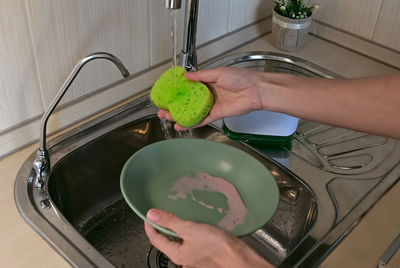 Cropped hand washing hands