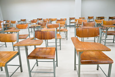 Empty chairs and tables in classroom