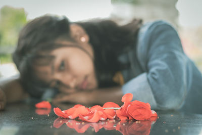 Concept of love break up, or failure, selective focus on red roses.