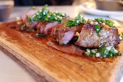 Close-up of meat on chopping board