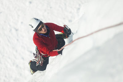 Woman climbs at ice park in lake city, colorado