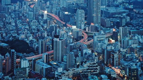 High angle view of illuminated cityscape at night