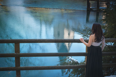 Woman standing by lake