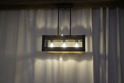 Close-up of illuminated electric lamp