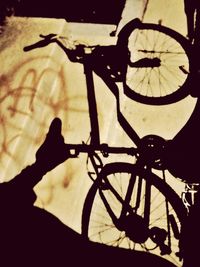 Silhouette of man riding bicycle on street