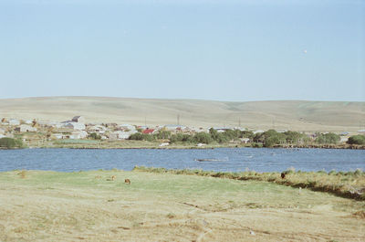 Scenic view of beach against clear sky