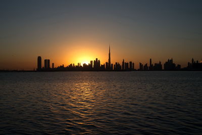 Dubai slyline from dubai creek harbour and dubai canal to downtown and business bay, uae