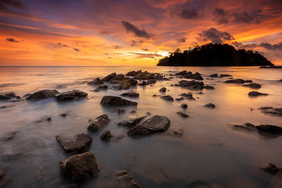 Tranquil sunset over rocky coastal landscape at pulau sayak kuala muda kedah malaysia