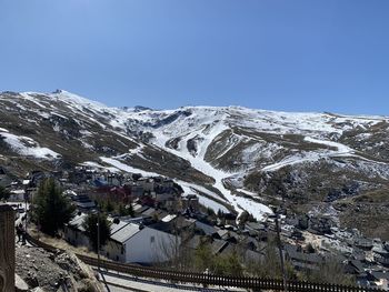 Scenic view of snowcapped mountains against clear sky