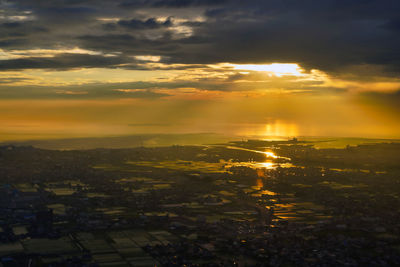 High angle view of buildings against sky during sunset