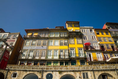 Low angle view of buildings against blue sky