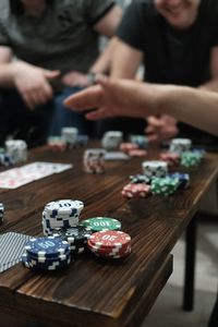 Male friends playing cards at table