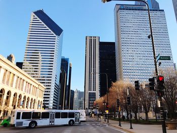 View of city street and buildings against sky