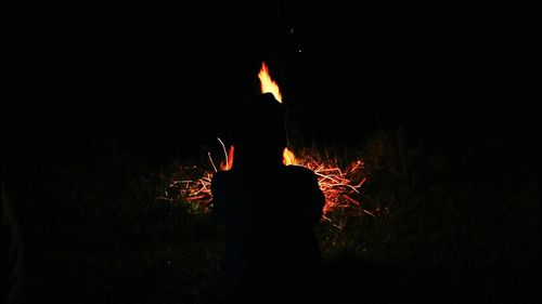 Silhouette of man at night