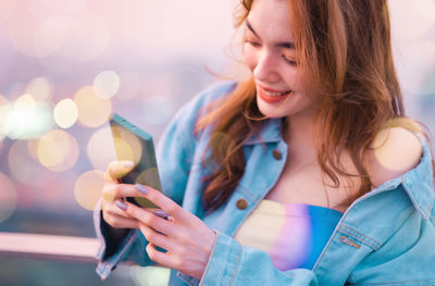 Young woman using mobile phone