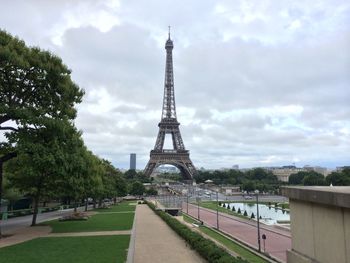 Silhouette of eiffel tower against cloudy sky