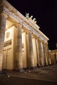 Low angle view of historical building at night