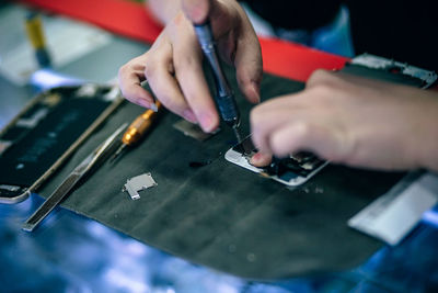 High angle view of person working on table